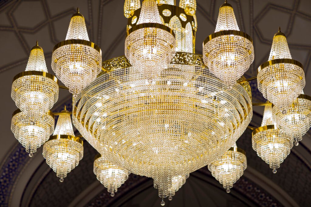 Grand chandelier in hotel lobby designed by Mrinal Lighting Premium Chandelier Manufacturer