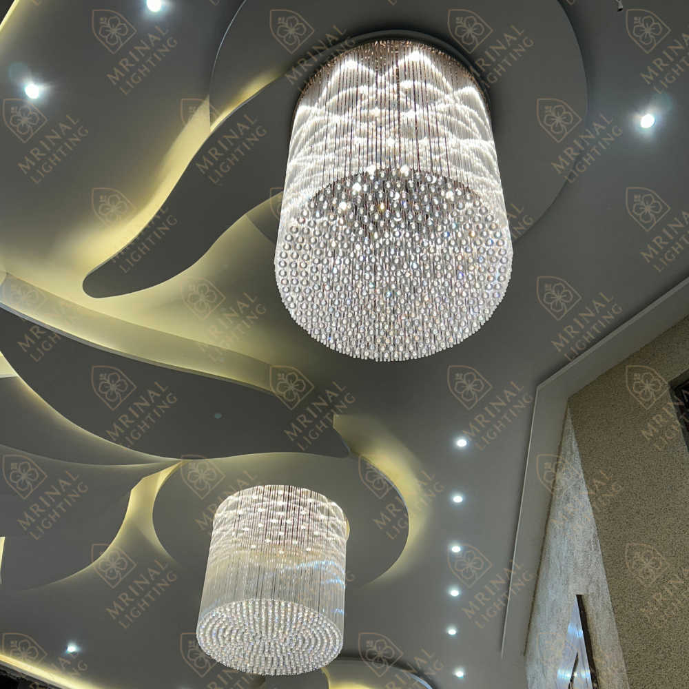 Modern gold ceiling chandelier with shining K9 crystals – a luxury design by Mrinal Lighting.